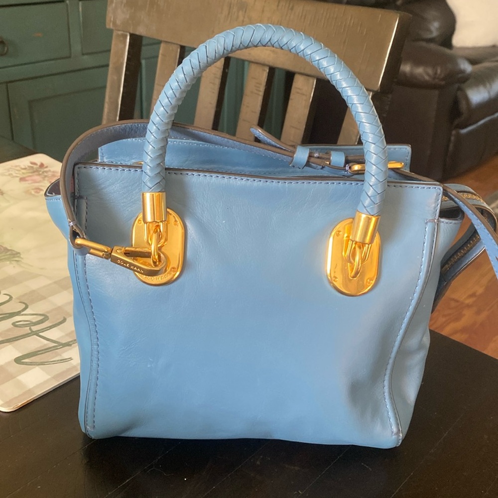 Cole Haan blue handbag with shoulder strap and short braided handles. Worn once.